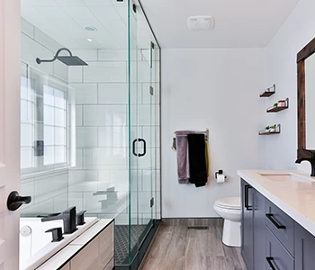 A sleek and modern bathroom with a shower and toilet.